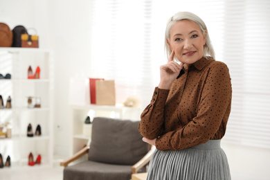 Confident female business owner in her boutique