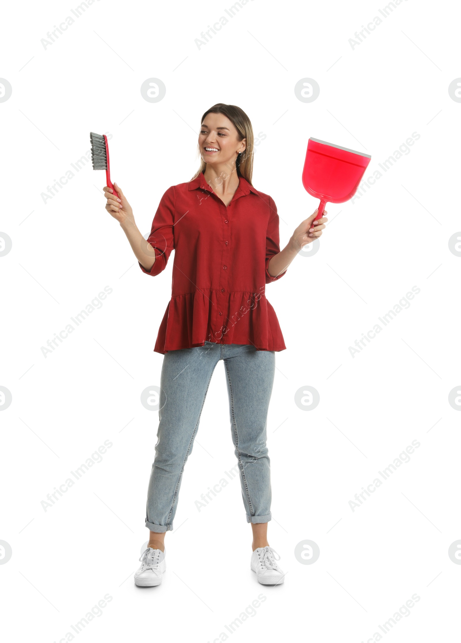 Photo of Young woman with broom and dustpan on white background