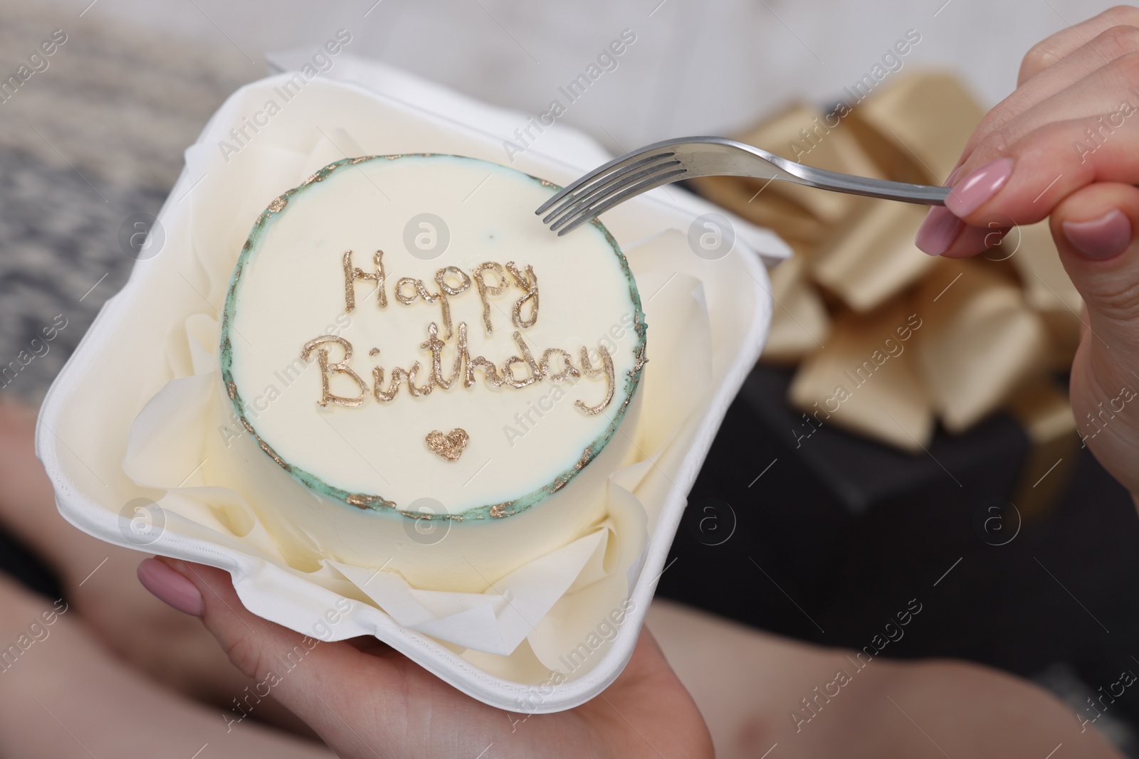 Photo of Woman eating her Birthday cake indoors, closeup