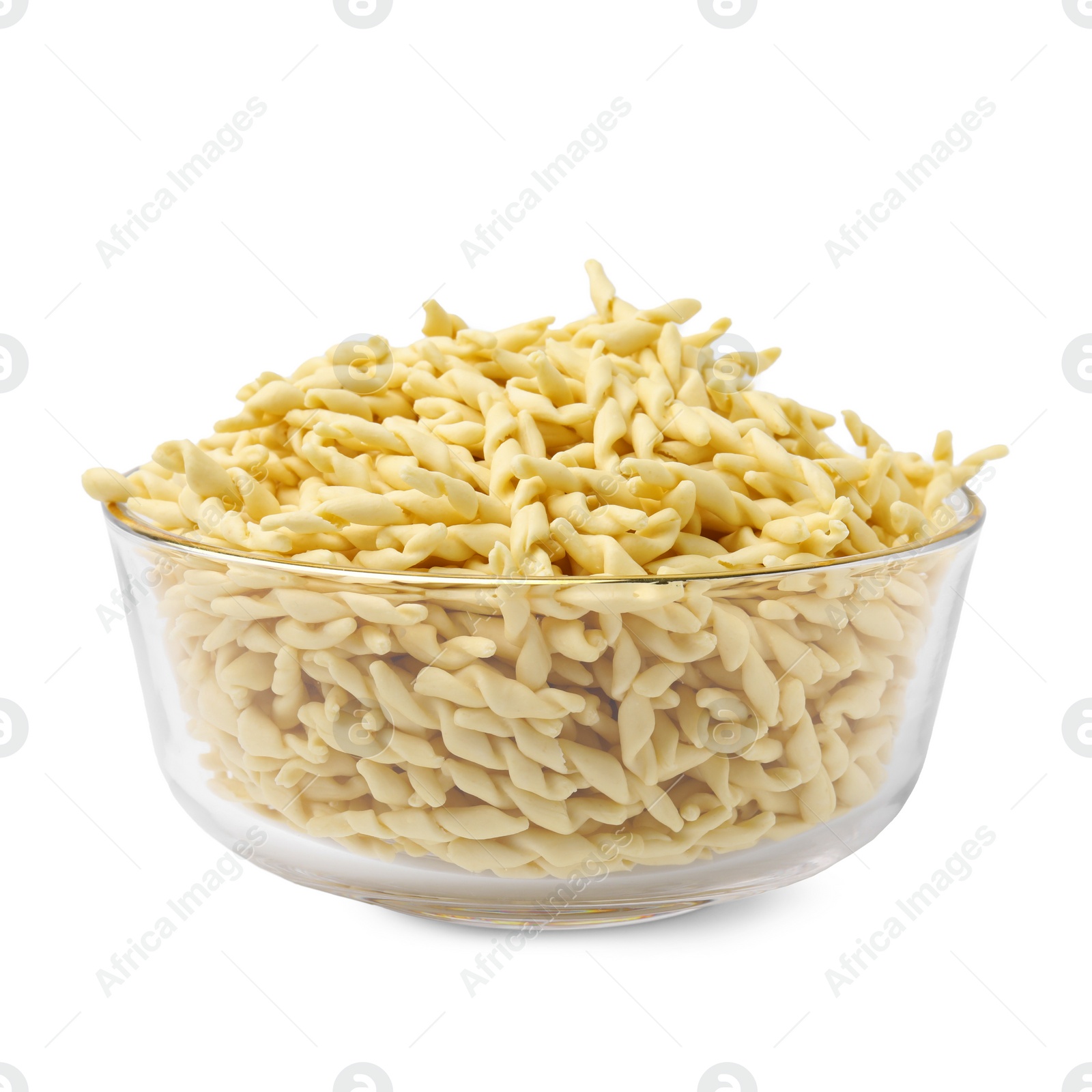 Photo of Uncooked trofie pasta in bowl isolated on white