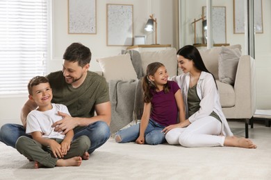 Happy family spending time together at home. Adoption concept