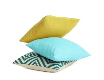 Different colorful decorative pillows on white background