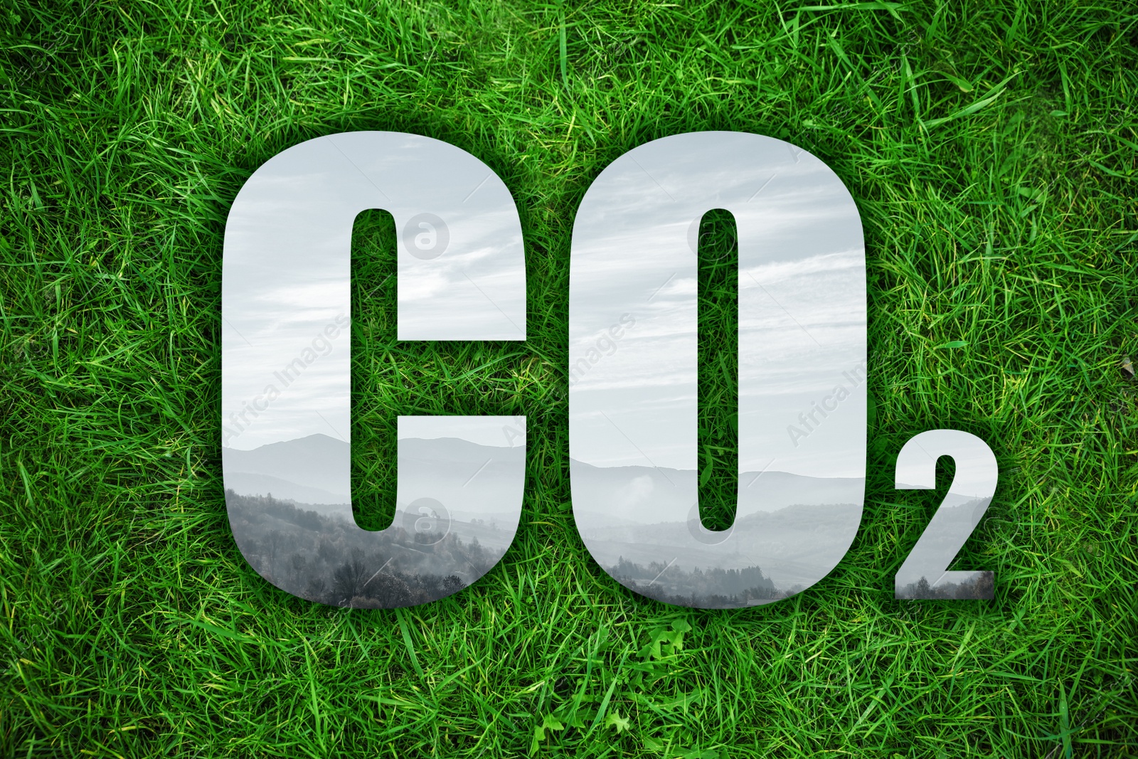 Image of Concept of clear air. CO2 inscription with mountain landscape inside letters and green grass on background