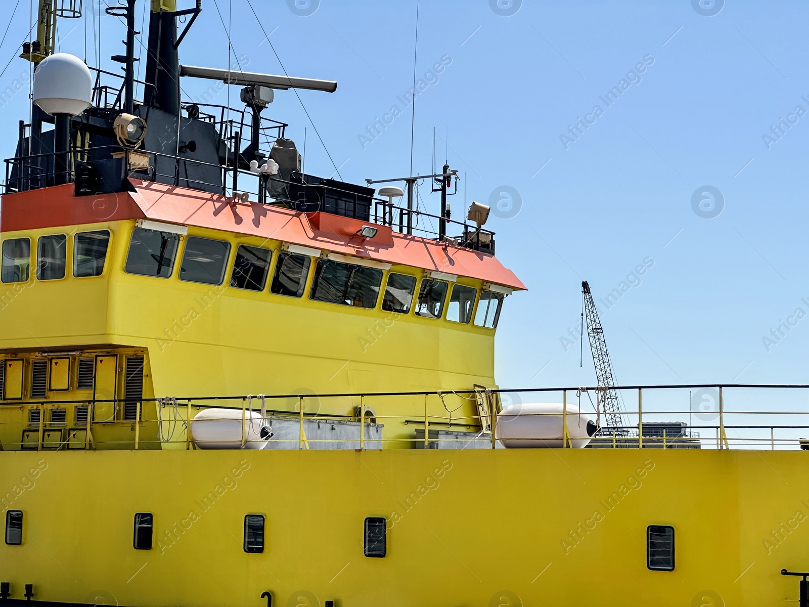 Photo of Ship moored in sea port on sunny day