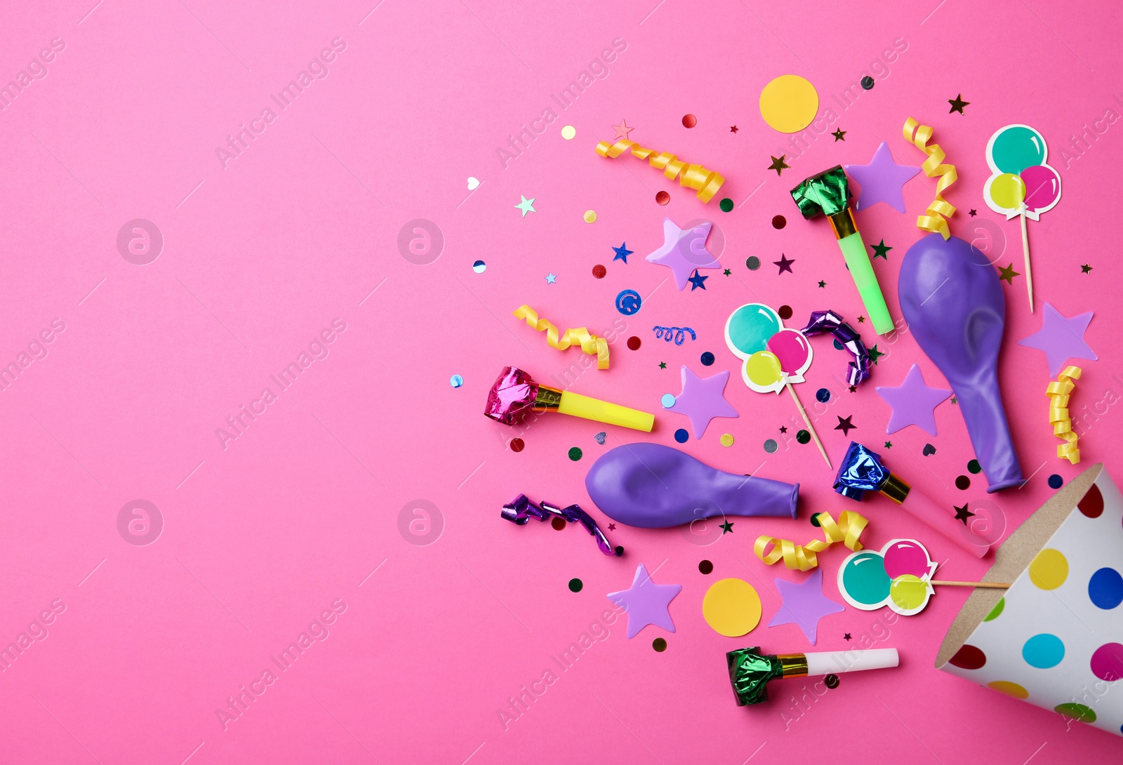 Photo of Flat lay composition with party cap on pink background. Space for text