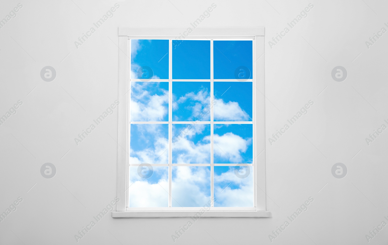 Image of Beautiful view on blue sky with clouds through window