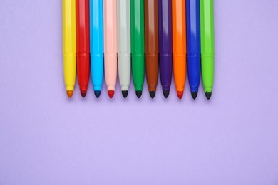 Photo of Different colorful markers on light background, flat lay. Space for text