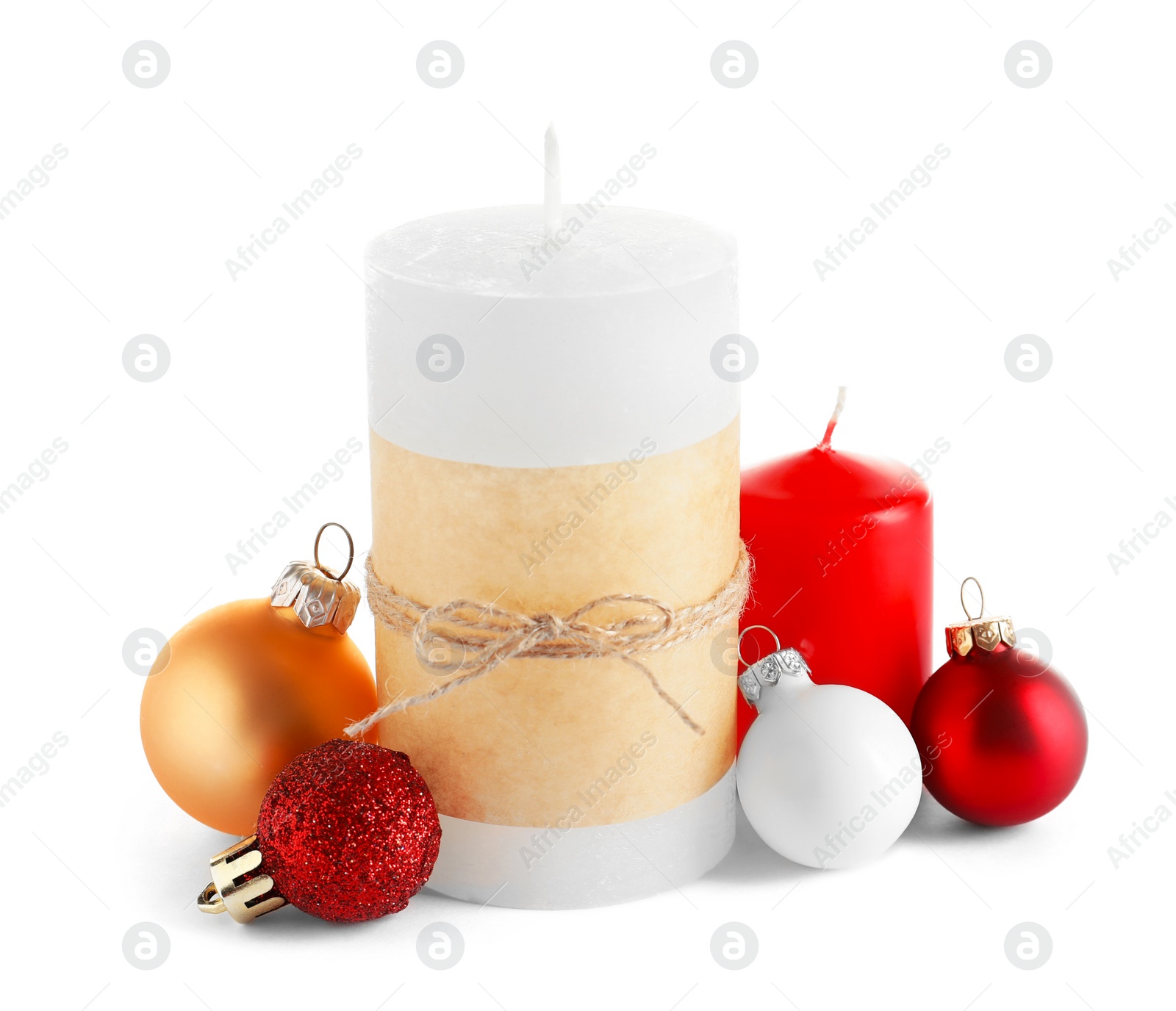 Photo of Different wax candles and Christmas decorations on white background