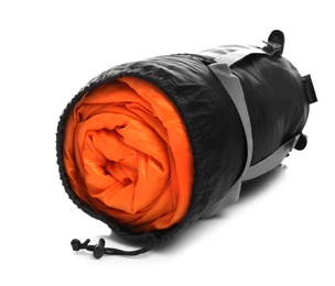 Photo of Sleeping bag in case on white background. Camping equipment