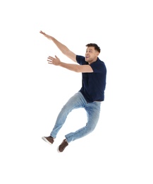 Emotional man in casual clothes posing on white background