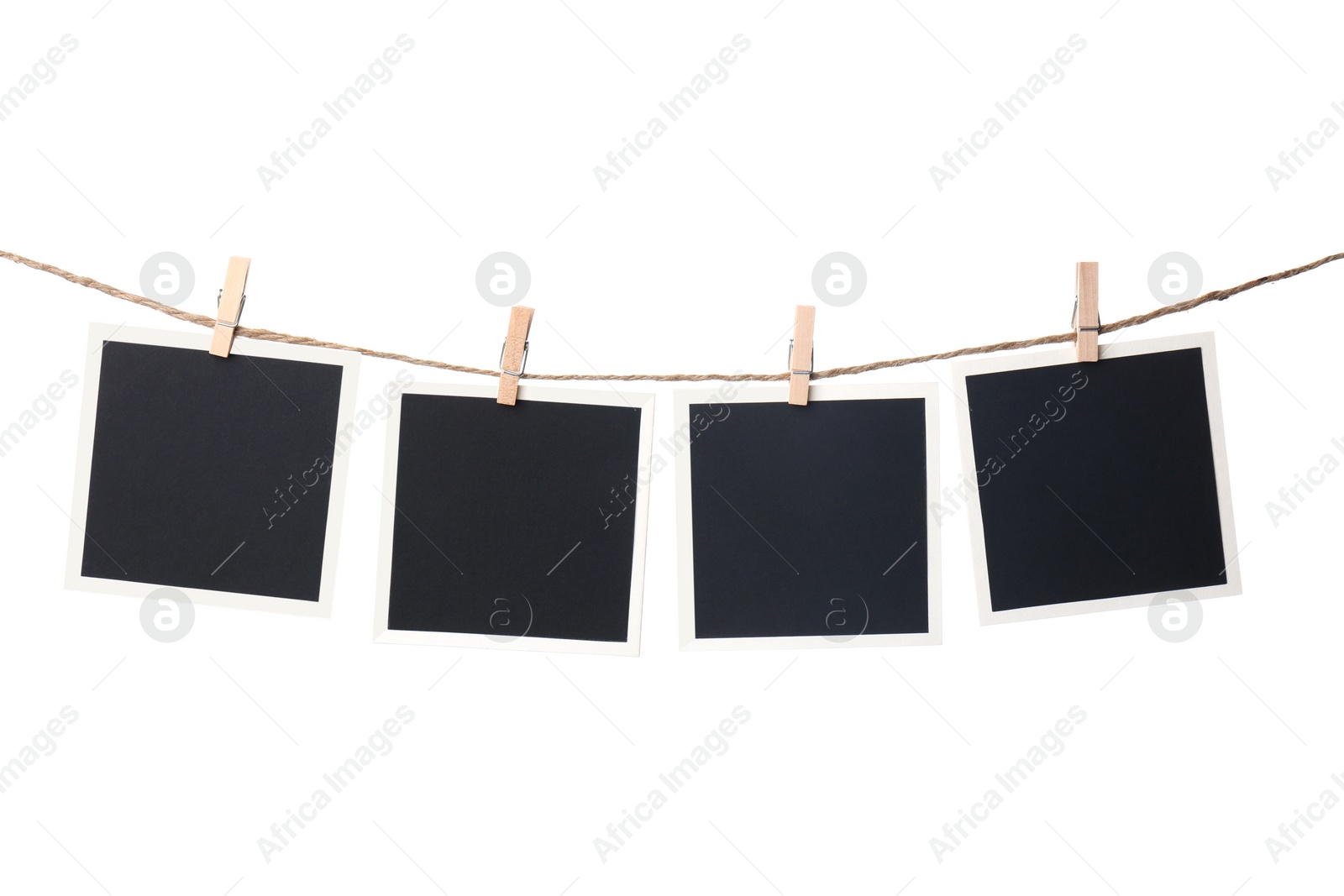 Photo of Clothespins with empty instant frames on string against white background. Space for text