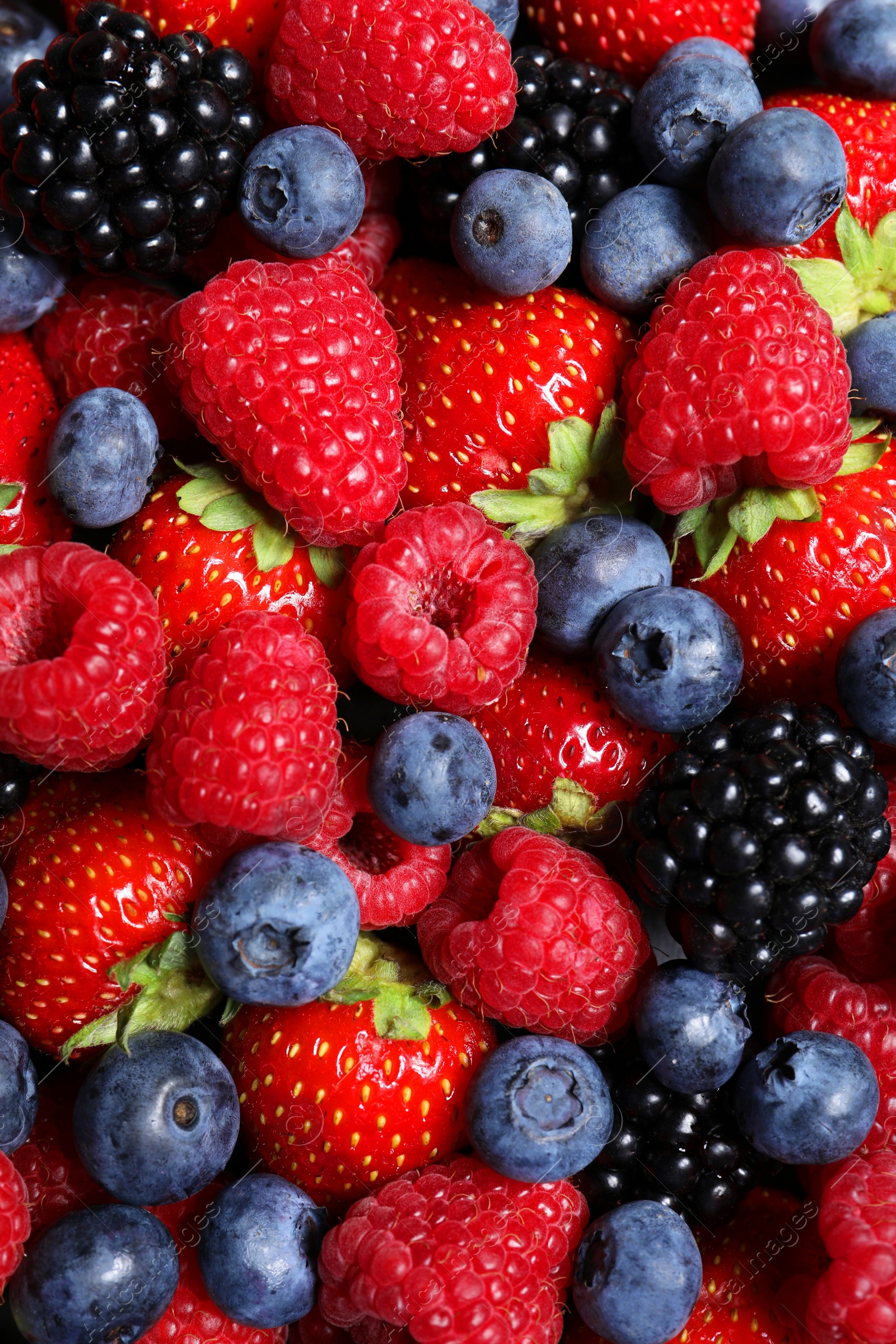 Photo of Assortment of fresh ripe berries as background, top view