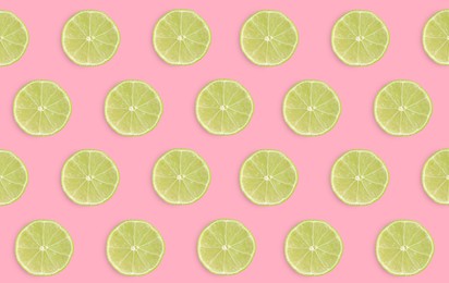 Image of Slices of limes on pink background, flat lay
