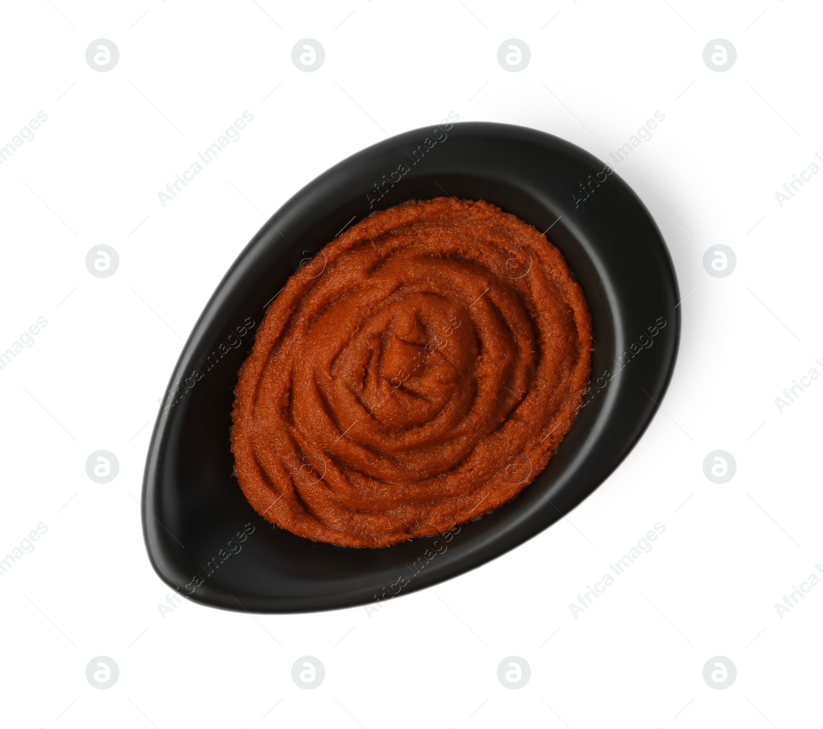 Photo of Tasty curry paste in bowl isolated on white, top view