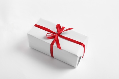 Photo of Beautifully wrapped gift box on white background