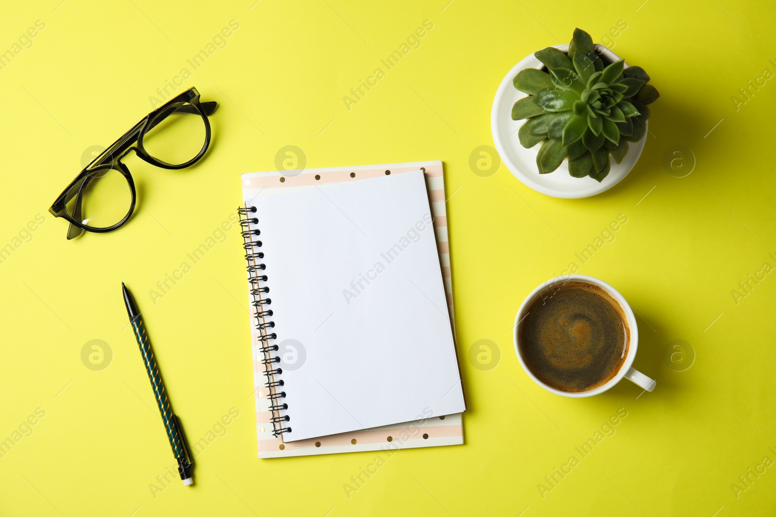 Photo of Flat lay composition with notebooks, coffee and plant on color background