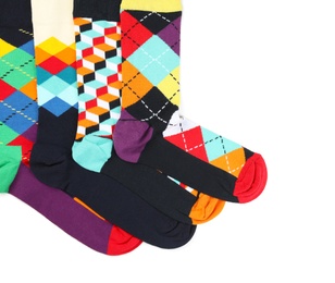 Colorful socks on white background, top view