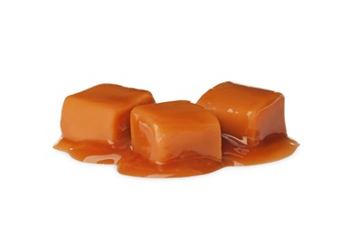 Photo of Caramel candies with topping on white background