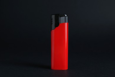 Photo of Stylish small pocket lighter on black background