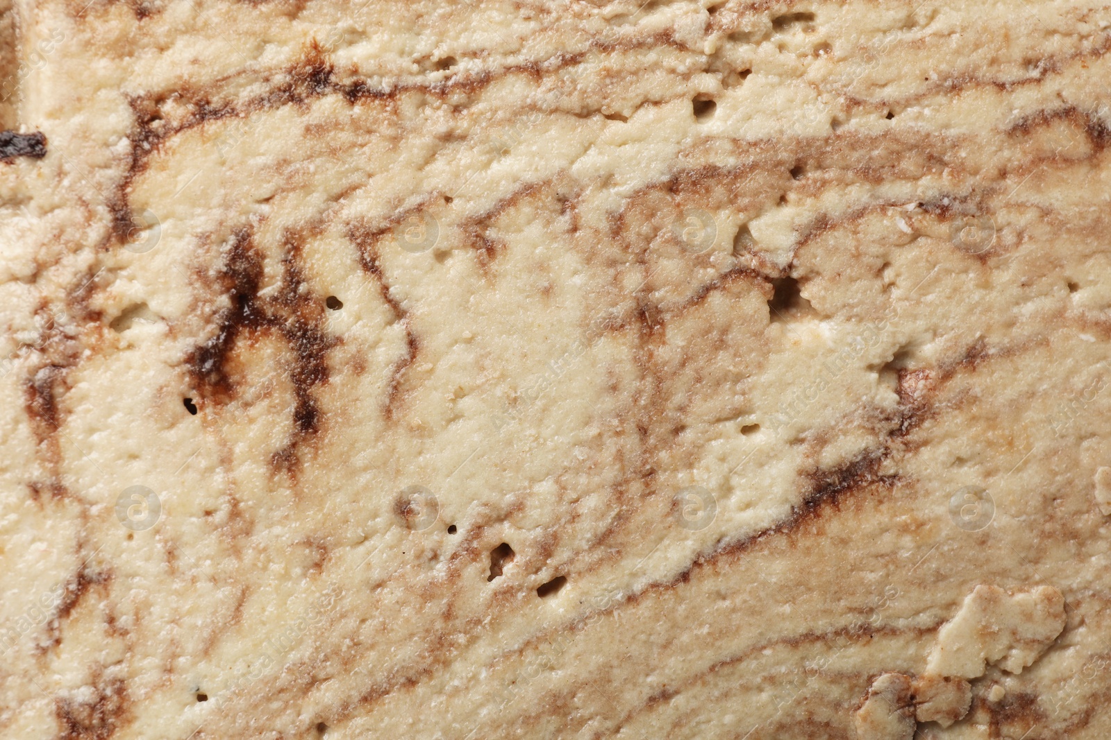 Photo of Tasty chocolate halva as background, closeup view