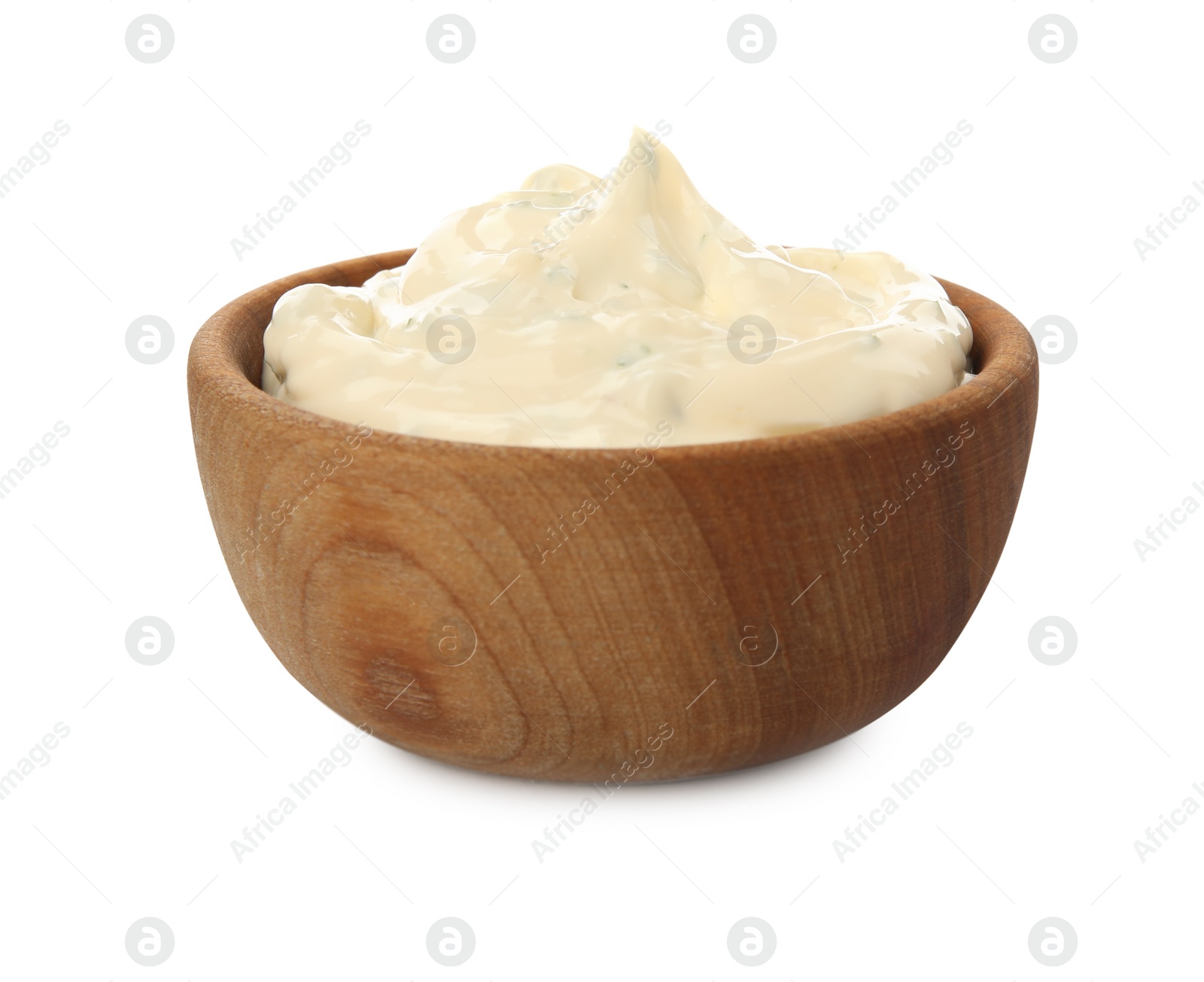 Photo of Tartar sauce in wooden bowl isolated on white