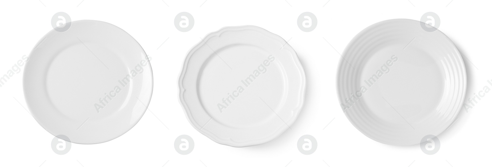 Image of Set of different ceramic plates on white background, top view