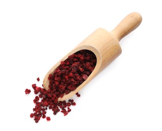 Dried red currants and wooden scoop on white background, top view