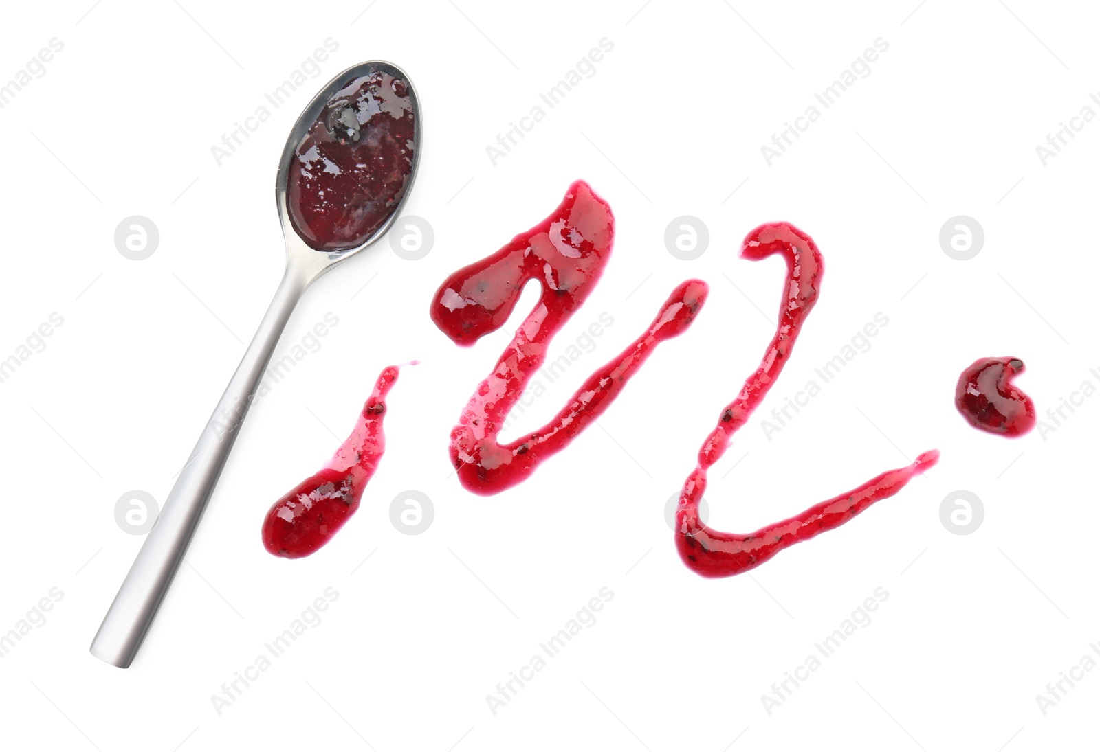 Photo of Tasty sweet jam and spoon isolated on white, top view