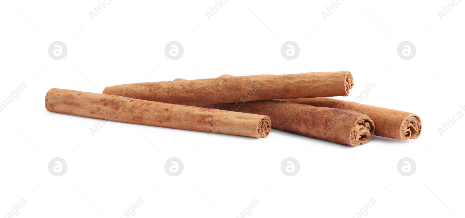 Photo of Dry aromatic cinnamon sticks isolated on white