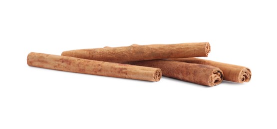 Photo of Dry aromatic cinnamon sticks isolated on white