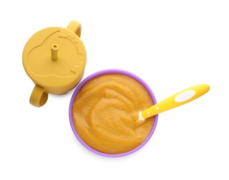 Healthy baby food in bowl and bottle with drink on white background, top view