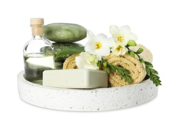 Photo of Spa composition. Cosmetic products, towels, stones and beautiful flowers on white background