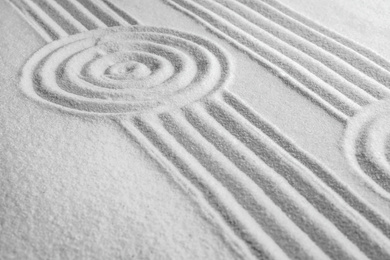 White sand with pattern as background. Zen, meditation, harmony