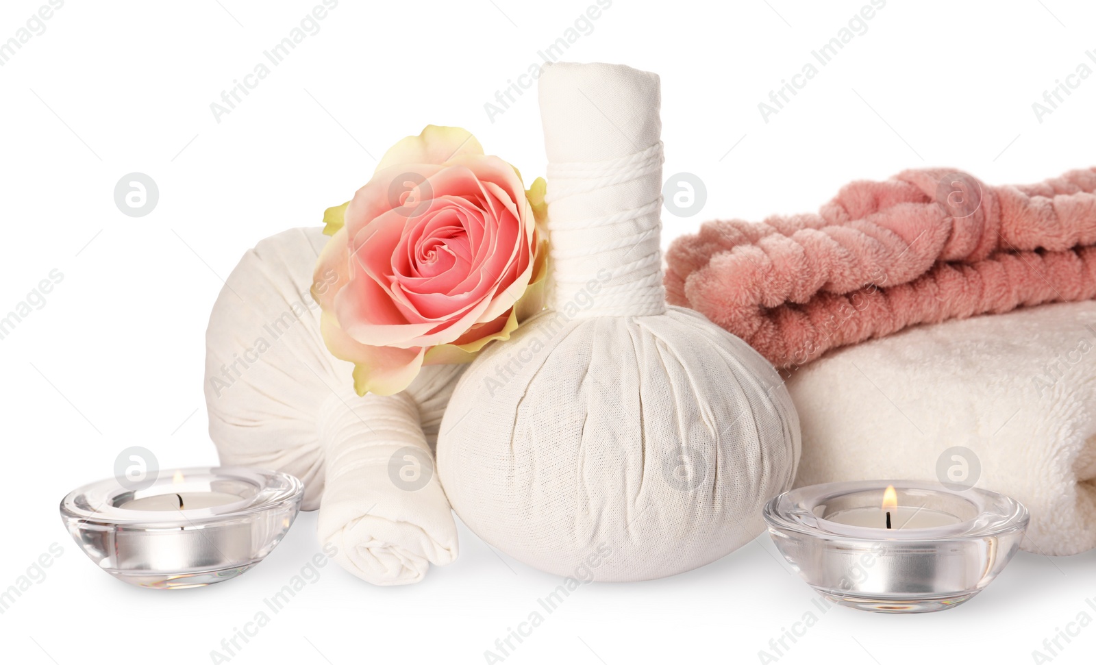 Photo of Beautiful spa composition with different care products, flower and burning candles on white background