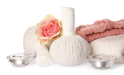 Photo of Beautiful spa composition with different care products, flower and burning candles on white background