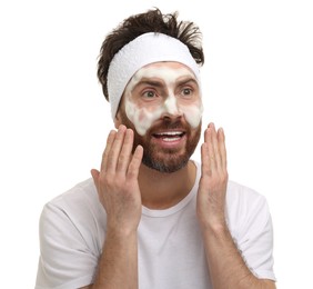 Photo of Emotional man with headband washing his face on white background
