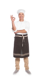 Photo of Mature male chef showing perfect sign on white background