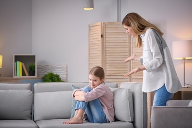 Mother arguing with daughter at home