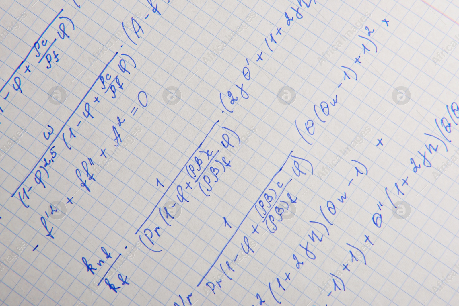 Photo of Paper with written mathematical calculations as background, closeup