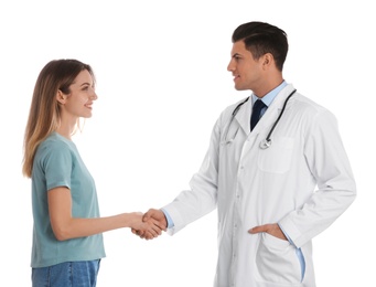 Photo of Doctor and patient shaking hands on white background
