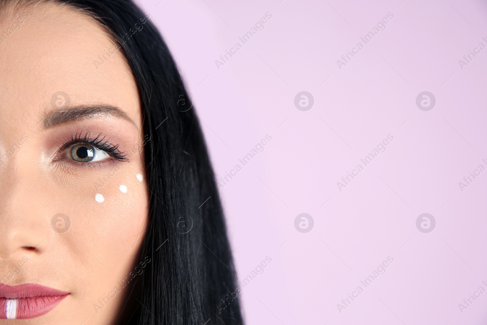 Photo of Young hippie woman with boho makeup on color background, closeup