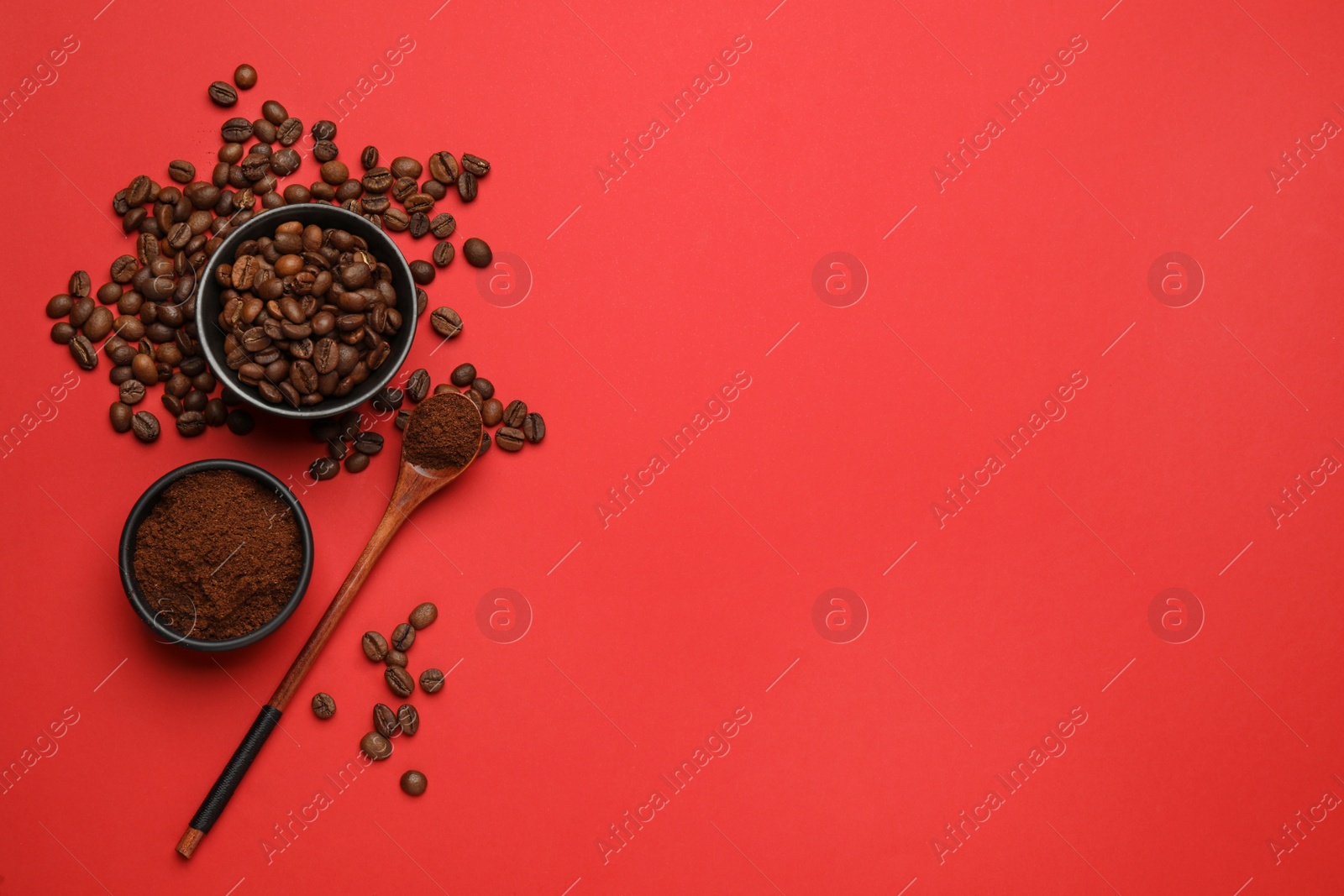 Photo of Ground coffee and roasted beans on red background, flat lay. Space for text