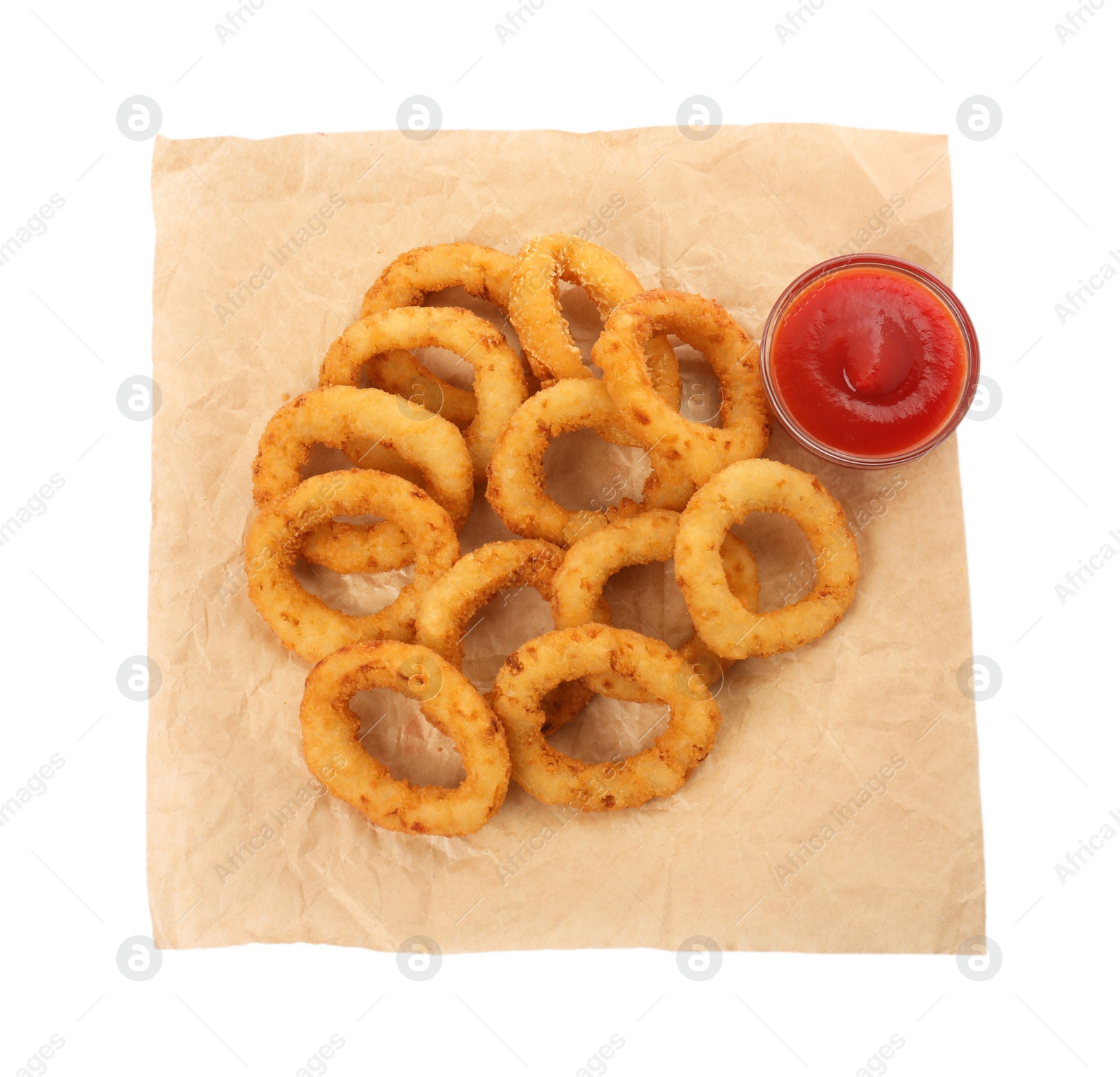 Photo of Tasty fried onion rings with ketchup isolated on white, top view