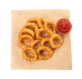 Tasty fried onion rings with ketchup isolated on white, top view