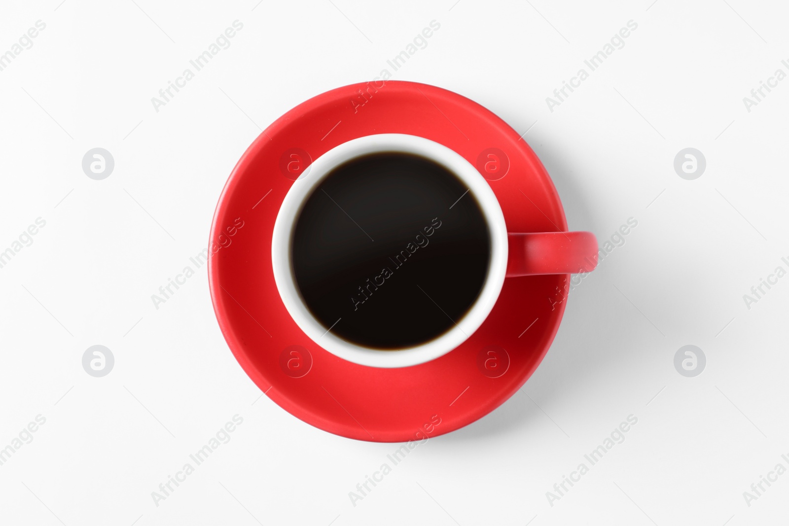 Photo of Red cup with aromatic coffee on white background, top view