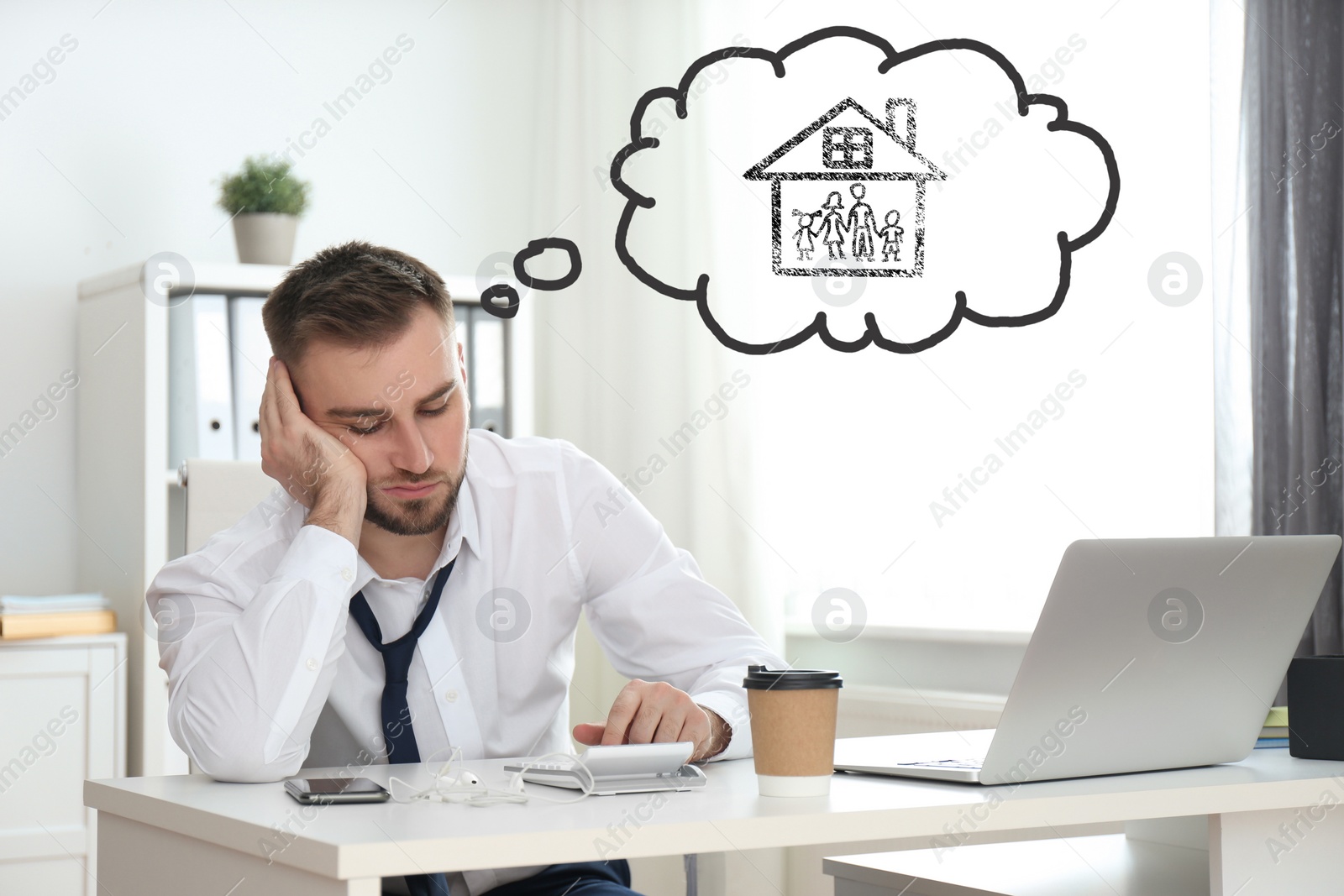 Image of Businessman dreaming about family in office. Concept of balance between life and work