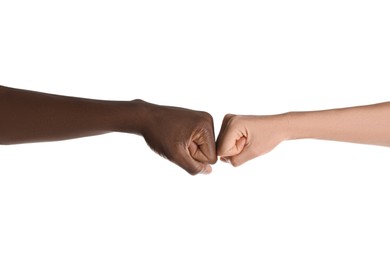 Photo of Woman and African American man making fist bump on white background, closeup