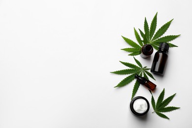 Photo of Flat lay composition with hemp leaves, CBD oil and THC tincture on white background, space for text
