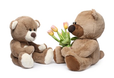 Photo of Cute teddy bears with beautiful tulips isolated on white