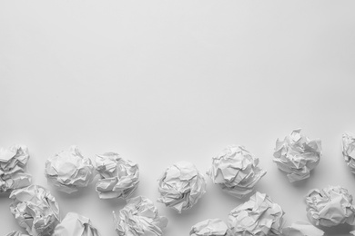 Crumpled sheets of paper on white background, top view